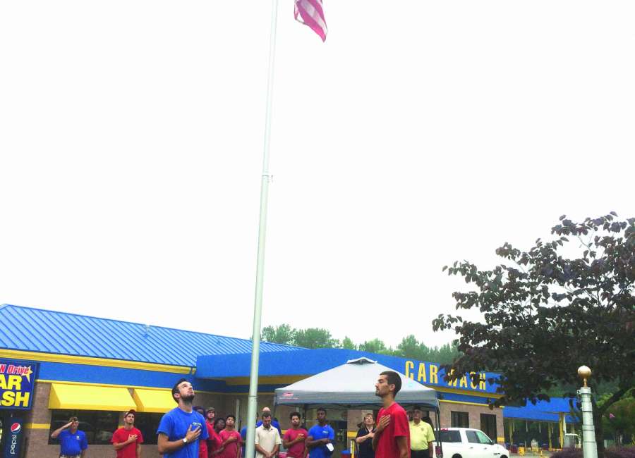 Car wash dedicates flag, pole
