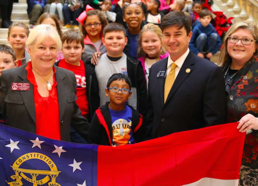 Newnan Crossing students take senator along for a bus ride