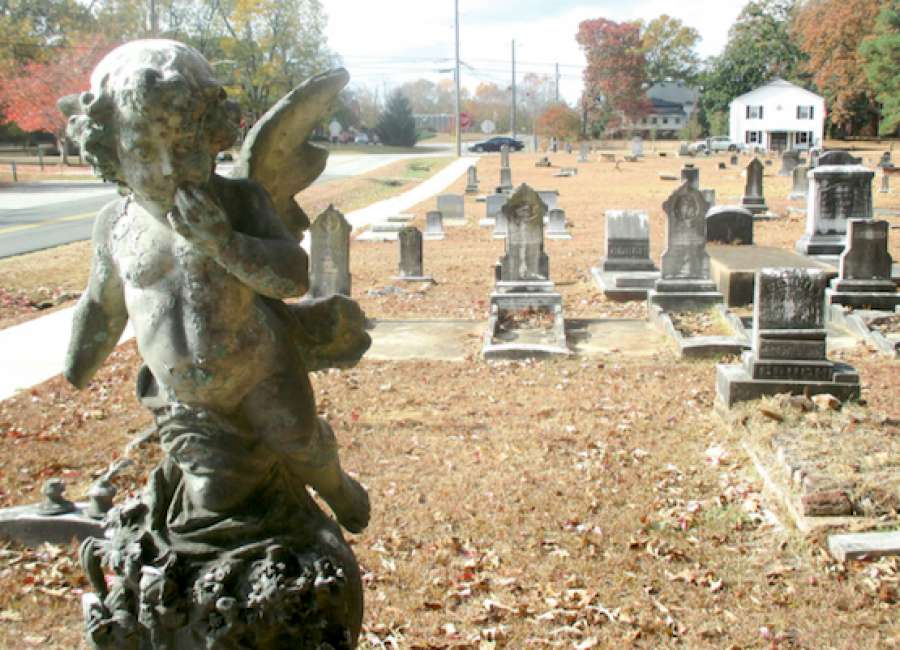 Old tombstones feature religious symbols