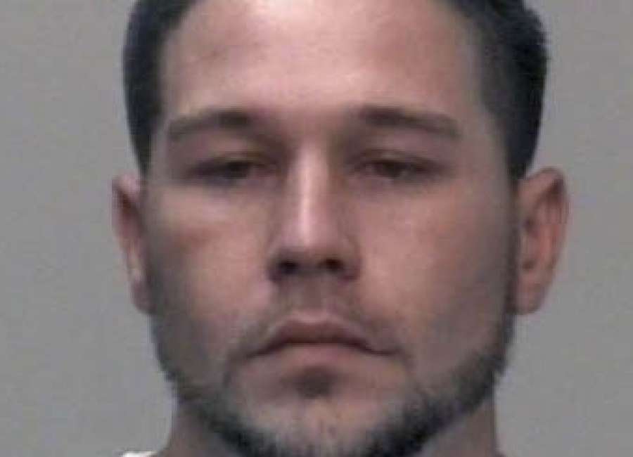 Parolee charged with trafficking