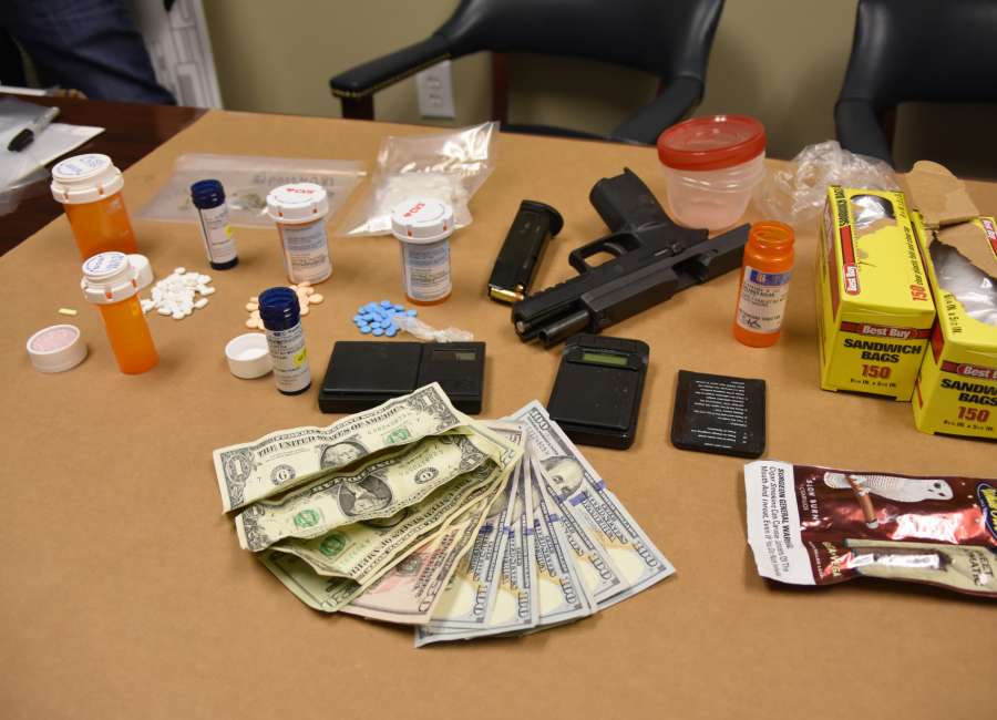 Drugs, guns and cash seized from two Coweta homes
