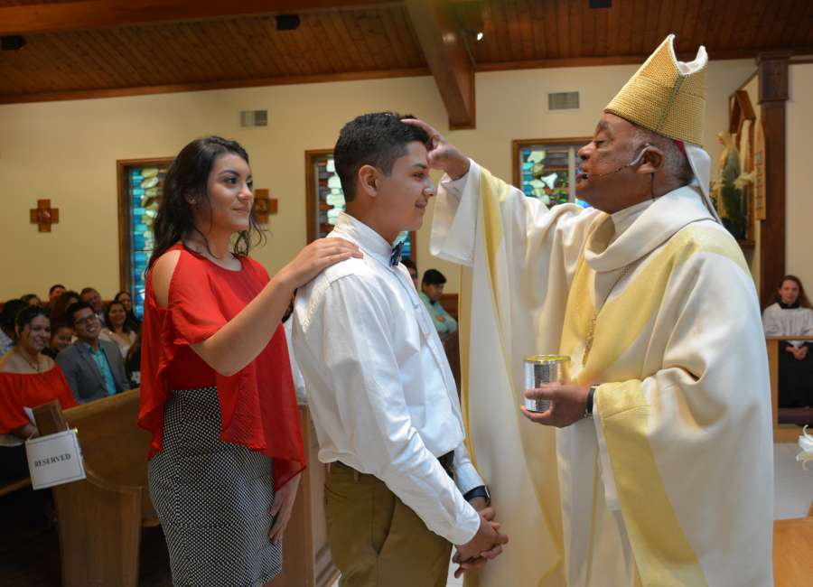 Fourteen confirmed at St. George Catholic Church