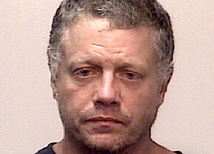 Man charged with assaulting neighbors