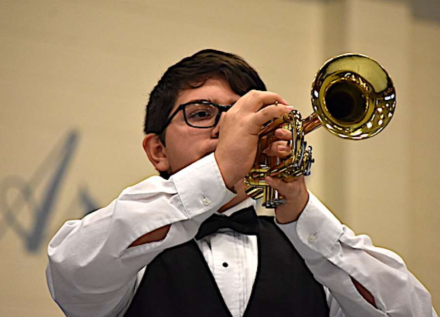 Students urge respect for the flag during Arnall program