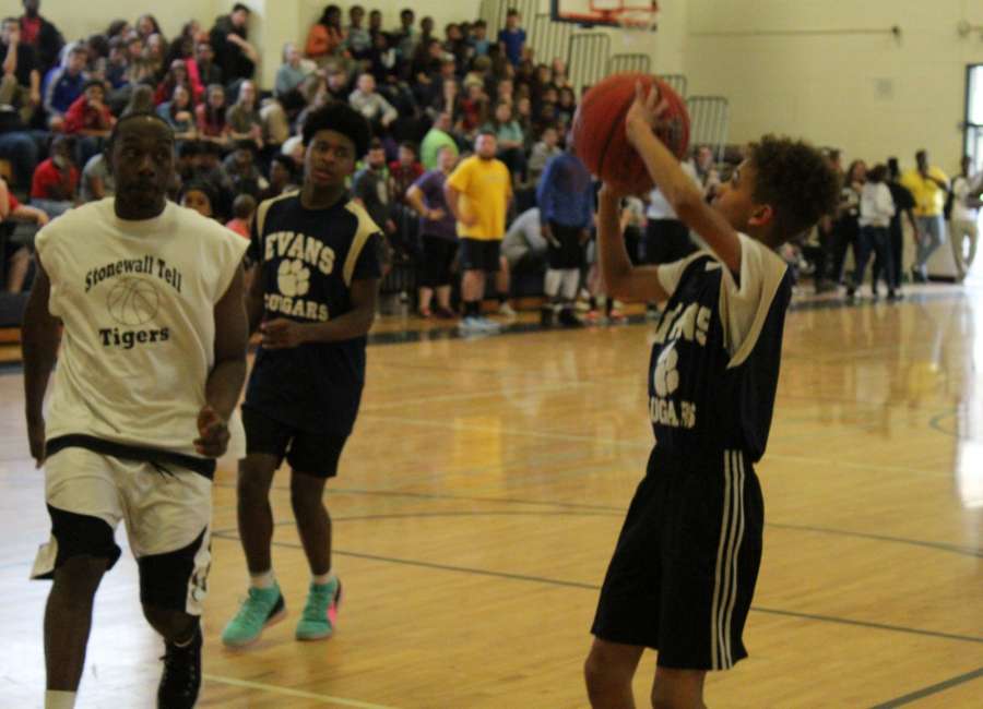 Evans Middle School students play against teachers in basketball game