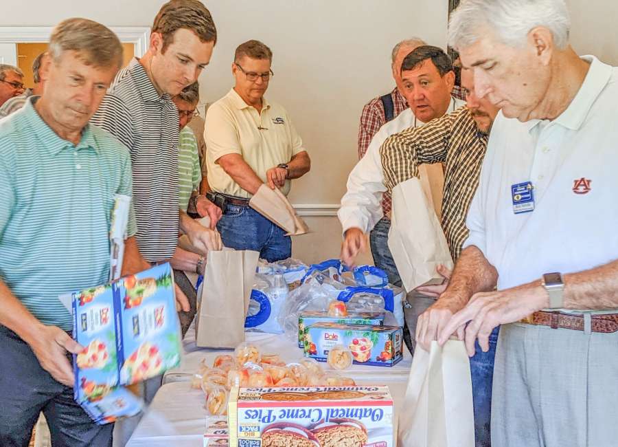 Kiwanians pack meals for area youngsters