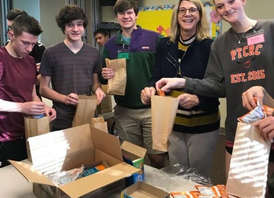 Mary Magdalene youth prepare snack bags